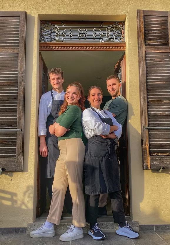 Ristorante Salotto Brè team in the restaurant doorway
